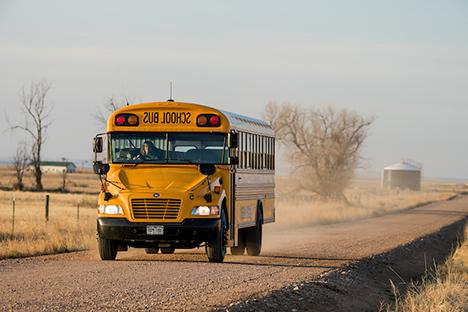 School bus on dirt road