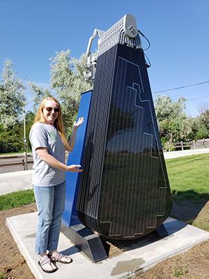 Marie Lee stands in front of the Solar Flower, which she led efforts for during her time at UNC.
